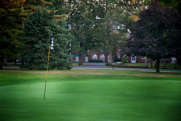 A golf course green outside the Gideon Putnam Hotel